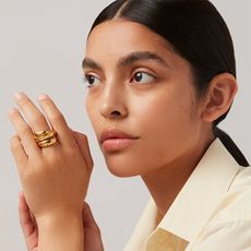 model wears Sées ring in gold from Jenny Bird