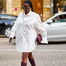 roundup of the best professional dresses, a promo photo of a woman wearing a white shirt dress