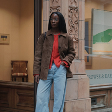 @_livmadeline wearing a cardigan, suede jacket and jeans